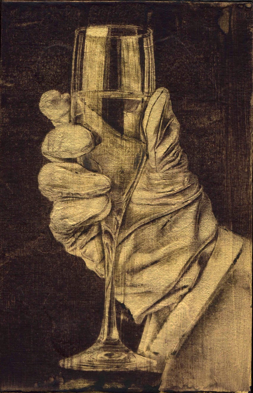 A gloved hand holds a stemmed glass upright; the glass sits in front of the fingers, with no face or table in the picture.