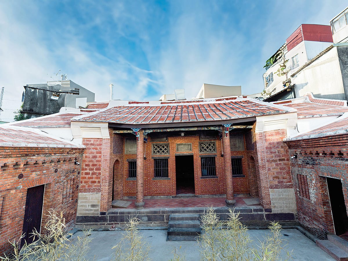 The restored red-brick courtyard and tiled roofs of Shi Family House in Tamsui.