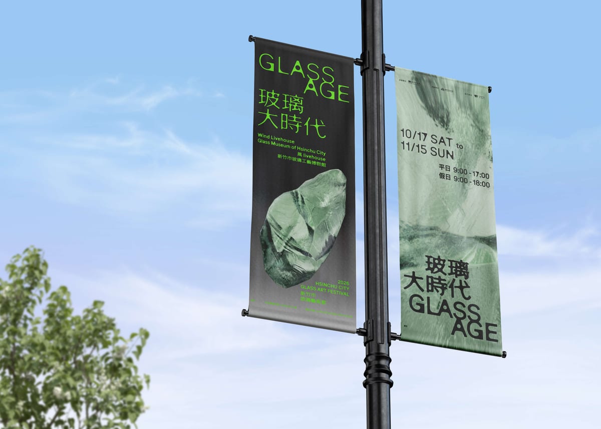 Black and green glass-festival banners name both venues, October 17–November 15 dates and opening hours.