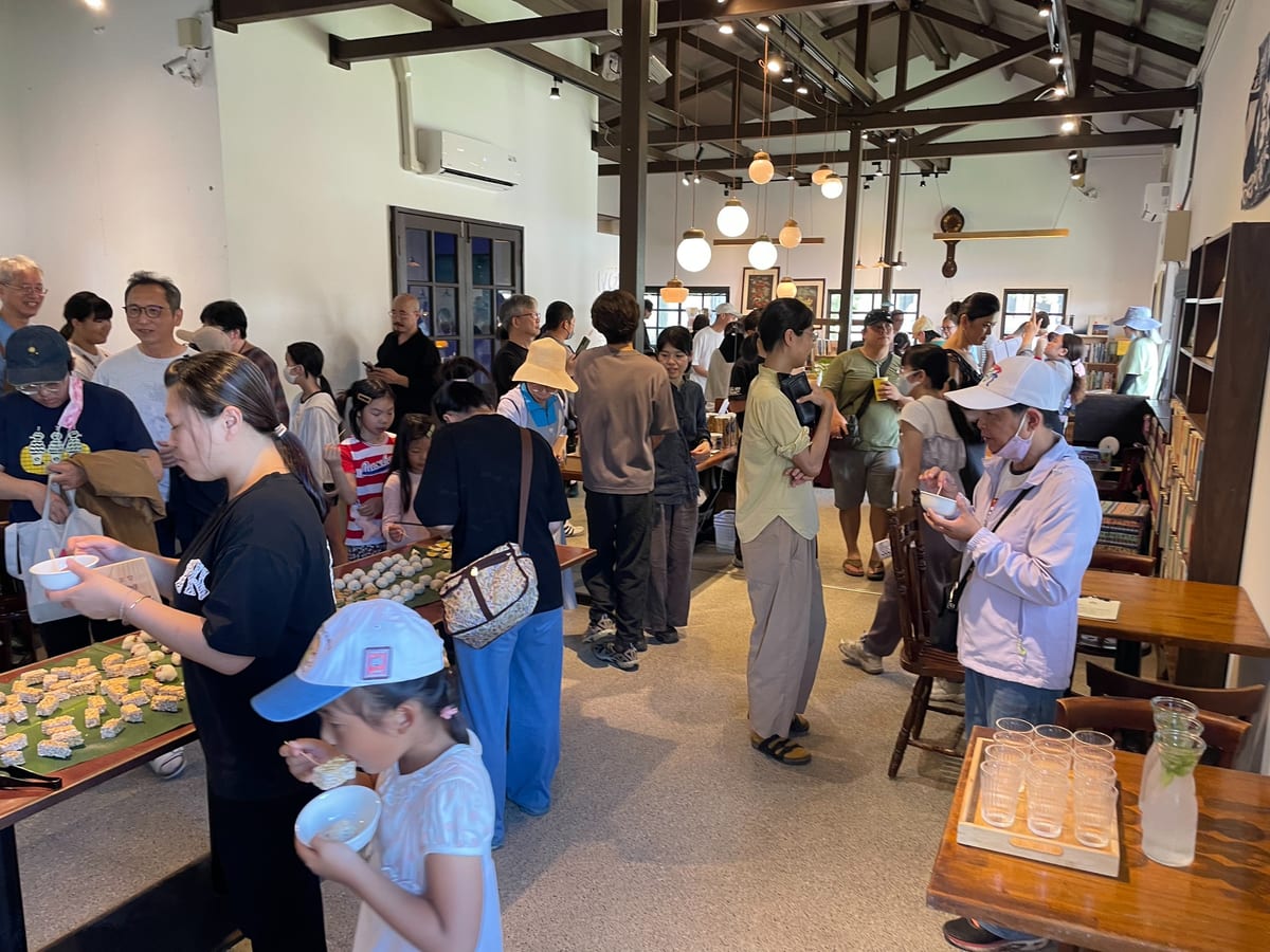 June 7, 2025 opening: guests eat beside the bookshelves at Book Forest.